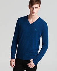 A rewarding sweater in handsome teal, rendered completely in soft cashmere for the ultimate luxury.