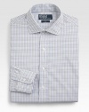 A trim, modern fit from ultra-silky 120s-quality two-ply cotton poplin yarns in a checked design for polished refinement. Buttonfront Moderate spread collar Embroidered logo detail Cotton Machine wash Imported 