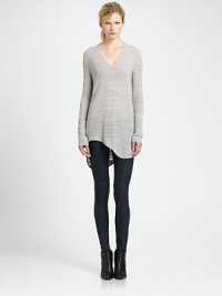 From the HELMUT capsule collection. Lengthy sweater takes on a modern silhouette with subtle distressing, dropped shoulders and an uneven hem. V-neckDropped shouldersLong sleevesAsymmetrical shirttail hem hits below hipsCotton/linen/nylonDry cleanImportedModel shown is 5'11 (178cm) wearing US size Small.