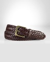 A sleek braided belt exudes timeless style in a supple leather construction.