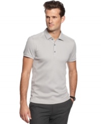 Need a style lift? This slim-fit polo shirt from Calvin Klein adds some sophisticated muscle to your polished look. (Clearance)