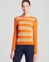 Creamsicle-colored stripes add texture and warmth to this vivid Theory sweater.