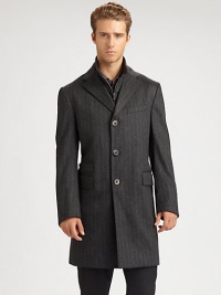 Chalk stripe overcoat is the perfect modern addition to your suiting wardrobe, expertly tailored in superior Italian wool, featuring a zip-out front vest panel, an additional front ticket pocket and velvet trim detail under the collar.Button-frontNotch lapelChest welt, waist flap pocketsRear ventWoolDry cleanMade in Italy