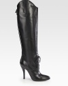 Towering high-heel boot of Italian leather, with a lace-up front and asymmetrical silhouette. Self-covered heel, 4½ (115mm)Shaft, 19Leg circumference, 13½Leather upperLace-up front with back zipBack strap with snap closureLeather lining and solePadded insoleMade in Italy