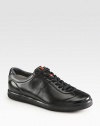 Sporty lace-up design rendered in sleek Italian calfskin leather.Leather upperLeather liningPadded insoleRubber soleMade in Italy