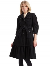 Military styling fused with ladylike influences for a luxurious wool overcoat that commands attention.Notched collar ¾ puffed sleeves with button tabs Front button closure Front button flap pockets Buckled belt ties at the waist Long ruffled hem About 40 from shoulder to hem Fully lined Wool; dry clean Made in Italy