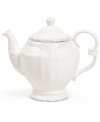 Embossed vines, graceful fluting and gently distressed accents give the Blanc teapot the classic, romantic feel of Versailles Maison's charming dinnerware collection.