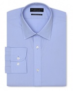 Dress shirt with spread collar, two button barrel cuffs and a contemporary fit through the body, with a solid blue hue.