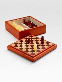 Become the king or queen of any party with a chess set handsomely crafted in leather-upholstered wood with an interlaced leather board. Set includes plastic chessmen and two blocknotes. From the Bugrane Collection 11¼W X 4½H X 11¼D Made in Italy