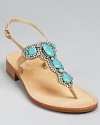 Translucent crystals rest atop shimmering metallic leather on a sleek and simple sandal silhouette. From IVANKA TRUMP.