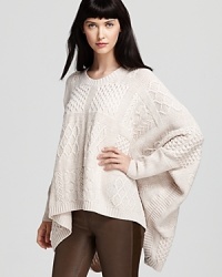 A fabulously versatile layer for fall, this multifaceted MARC BY MARC JACOBS sweater, offers stylish warmth in an oversized poncho cape silhouette--a retro favorite that's back and more sought after than ever.