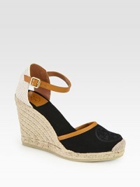 Rich canvas with smooth leather trim forms this classic silhouette, resting on a textured espadrille wedge. Covered wedge, 4 (100mm)Covered platform, ½ (15mm)Compares to a 3½ heel (90mm)Canvas upper with leather trimAdjustable ankle strapCanvas liningRubber solePadded insoleImported