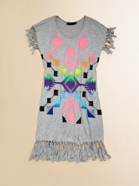 This soft knit style is printed with a vibrant, tribal-inspired patterned and decorated with knotted fringe.Jewel necklineFringe-trimmed cap sleevesFringe-trimmed hemlineScreen-printed detailRayonHand washImported