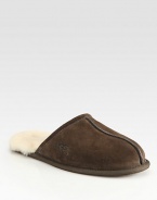 Warm, comfortable suede slip-ons are fully lined in sheepskin with a sheepskin sockliner that naturally wicks away moisture and helps keep feet dry. Lightweight sueded rubber outsole with embossed logo Imported