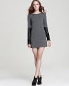 Exude modern edge in this 10 Crosby Derek Lam sweater dress boasting leather sleeves for downtown cool with uptown appeal.