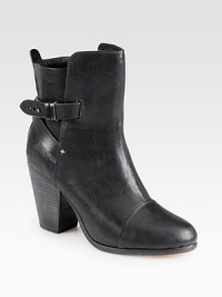 Ever-classic ankle boot in sumptuous leather with crisscrossed strap details for a subtle edge. Stacked heel, 3¾ (95mm)Leather upperPull-on style with adjustable ankle strap with metal pull-tabsLeather lining and solePadded insoleImported