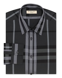 A broad check pattern blending tonal hues distinguishes this handsome dress shirt from Burberry.