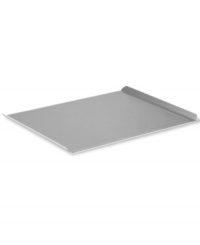 Welcome to a world of baked greats! Perfect for cookies, dinner rolls, pastries and beyond, this large cookie sheet features two upturned ends for easy lifting and open sides, so food slides right off. Crafted with a heavy-gauge steel core for even heating, this pan features two interlocking layers of professional nonstick for gentle release. Lifetime warranty.