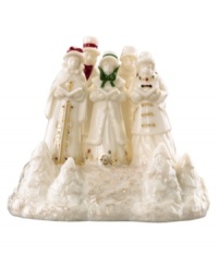 Make the townsfolk of Mistletoe Park Village sing with the addition of this fine porcelain figurine. A troupe of traditional Christmas carolers evokes the most cherished sounds of the season. With gold detail and glitter.