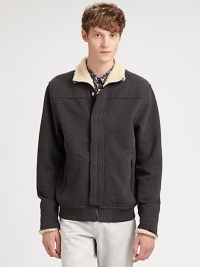 A casual wardrobe staple, this zip-up jacket breathes new life to an old favorite; crafted in a supremely soft cotton blend with a faux-sherpa lining at the collar and cuffs for the ultimate experience of style and comfort.Zip frontSnap-button placketSide slash pockets85% cotton/15% polyesterMachine washImported