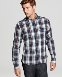 Sport a traditional plaid pattern in comfortable cotton twill with this work-friendly button-down, a handsome design with rugged appeal. From Edun.