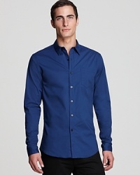 Solidify your wardrobe with a handsome button-down from Elie Tahari, a bold look in comfortable cotton with a bit of stretch to accommodate your full range of motion. Note the contrast button front, too, which subtly articulates your unique personality.