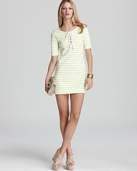 Nautical goes neon as crisp key-lime stripes adorn the snappy silhouette of this Juicy Couture dress. A lace-up placket anchors the trend.