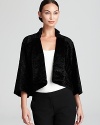 Geometric tailoring and clean lines craft a striking T Tahari jacket, accentuated with allover faux fur for real exotic edge.