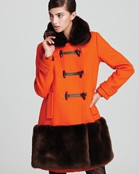 A shockingly chic approach to cold weather, this kate spade new york coat strikes at a distance with plush faux-fur trim and a bold, boxy silhouette.