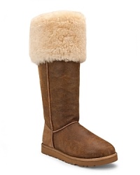 A wide shearling cuff adds cozy style to the classic suede Bailey boot from UGG® Australia. It's high style.