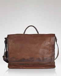 Distressed for rugged appeal, this Frye messenger bag gives you that hard-earned timeworn appearance of a seasoned traveler. The organizational pockets inside assist with your morning commute and day-trips downtown alike. A quality design from Frye, renowned for classic craftsmanship.