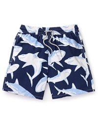 A shiver of great white sharks patrols the waters on these cool swim trunks from Vilebrequin, the preeminent name in swimwear for men.