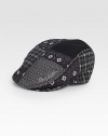 A signature array of distinctive prints and patterns adorns this traditional driver cap style, rendered in an exquisite blend of Italian wool and silk.50% silk/25% polyester/25% woolDry cleanImported of Italian fabric