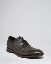 Stately wingtips from John Varvatos have a distinctively masculine edge that grounds your attire in timeless leather.