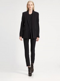 Underlying front placket adds a layered effect to this oversized wool-rich blazer. Notched collarButton placket underlayLong sleevesFront flap pocketsBack slitAbout 29 from shoulder to hemVirgin wool/nylon/LycraDry cleanImported of Italian fabricSIZE & FITModel shown is 5'10 (177cm) wearing US size 4. 