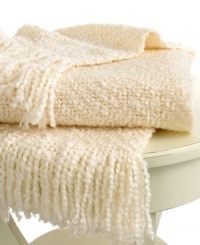 Beat the cold with this super-soft throw from Lauren Ralph Lauren. Features a boucle knit in a cream hue for a cozy addition anywhere in your home. Finished with a 3 fringe.