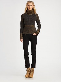 A chunky pullover in a variety of rich melange yarns has an intriguing tweedy effect.Ribbed turtleneck collarContrast shouldersSlightly tapered at the waist with logo tagLong sleeves with wide ribbed contrast cuffsWide ribbed subtly flared hemAbout 22 from shoulder to hemWool/nylon/silkDry cleanImportedSIZE & FITModel shown is 5'10½ (179cm) wearing US size Small. 