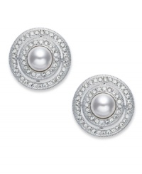 Frame your look with Eliot Danori's elegant button earrings. Featuring framed simulated pearls (6 mm) with genuine mother-of-pearl coating. Embellished with crystal accents. Set in rhodium-plated mixed metal. Approximate diameter: 5/8 inch.