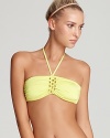 Retro-right goldtone hardware defines a classically chic bandeau bikini top from designer Trina Turk.