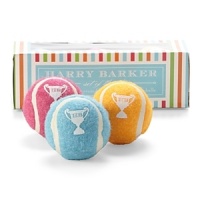 All dogs are Best in Show with these brightly colored miniature play balls from Harry Barker featuring whimsical trophy decals. Natural rubber covered in sturdy felt makes each one a fun and durable toy for furry friends.