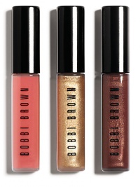 Shimmer, sparkle and shine. Bobbi's Lip Trio, is here in three beautiful shades and textures. Wear each shade alone for a quick pop of color or layer over lipstick for extra shine. Shades: Kir Sugar Shimmer, Gold Glitter Lip Gloss and Bright Pink Lip Gloss 