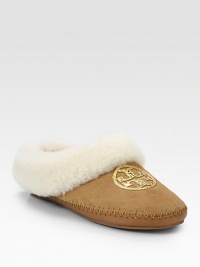 Light-catching sequins form a signature medallion on this casual suede staple lined with cozy shearling. Suede and shearling upper with sequinsShearling liningRubber solePadded insoleImported