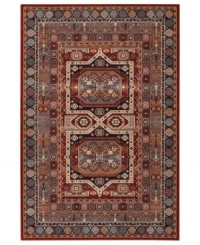 A variety of intricate symmetrical patterns in a bold red and dark blue colorway create a captivating focal point for any space in this area rug from Couristan. Crafted of pure New Zealand wool for long-lasting strength and beauty.