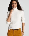 The ideal contrast to of-the-moment printed pants and colored denim, this C by Bloomingdale's turtleneck flaunts a classic silhouette in sumptuous cashmere for instant chic.