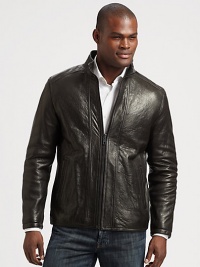 Make a statement without saying a word in this exquisite leather jacket treated perfectly to exude a look that is both rugged and refined.Zip frontStand collarSide slash pocketsAbout 28 from shoulder to hemLeatherDry cleanImported