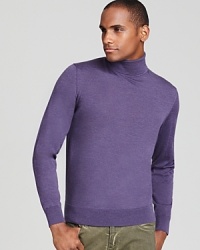 Rendered in virgin merino wool for uncommon softness, this handsome turtleneck acknowledges your taste for classic refinement.