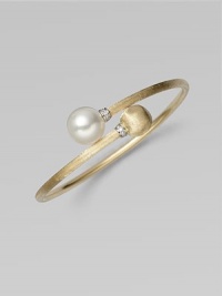 Brushed 18k yellow gold, luminous diamonds, and an iridescent pearl richly combine to create this artistic, elegant design.Diamonds, 0.06 tcw Freshwater pearl 18k yellow gold Diameter, about 2½ Made in Italy