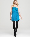 Get the party started in this chic strapless dress with stylish pleats and cascading ruffles down the front.