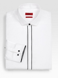 This crisply tailored slim-fit style is accented with bold contrast piping and contrast buttons.Spread collarButton frontBarrel cuffsAbout 30 from shoulder to hemCottonDry cleanImported