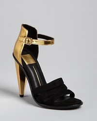 These strappy evening sandals are perfect for a black tie event or an evening of cocktails. Wear with a mini to showcase the gold backs or pants for a more subdued glint of gilt.